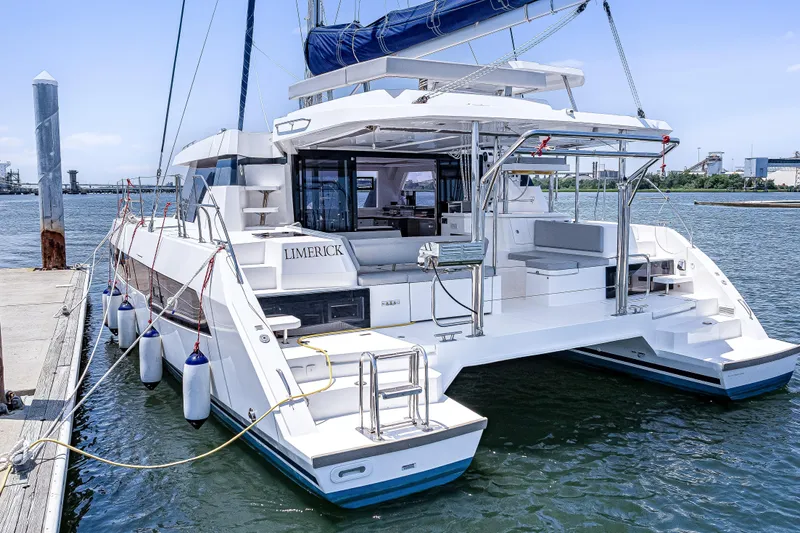 Limerick Yacht Photos Pics 2023 Leopard 42 catamaran docked at marina, featuring spacious deck and modern design.