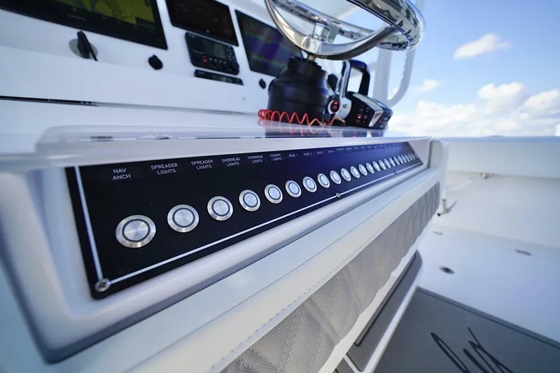 Little Lady Yacht Photos Pics Control panel of 2024 Invincible 35 Catamaran with modern navigation and lighting systems.