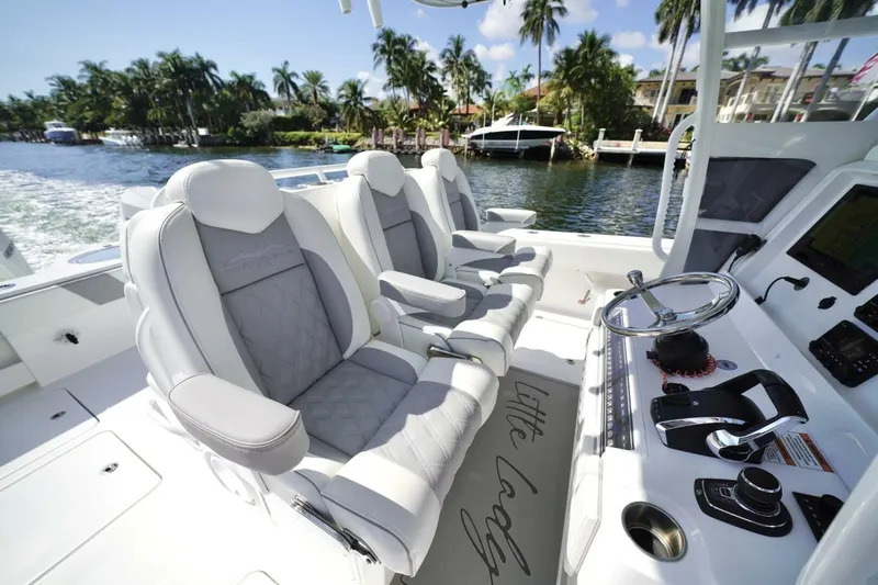 Little Lady Yacht Photos Pics 2024 Invincible 35 Catamaran interior with luxurious seating and modern controls.