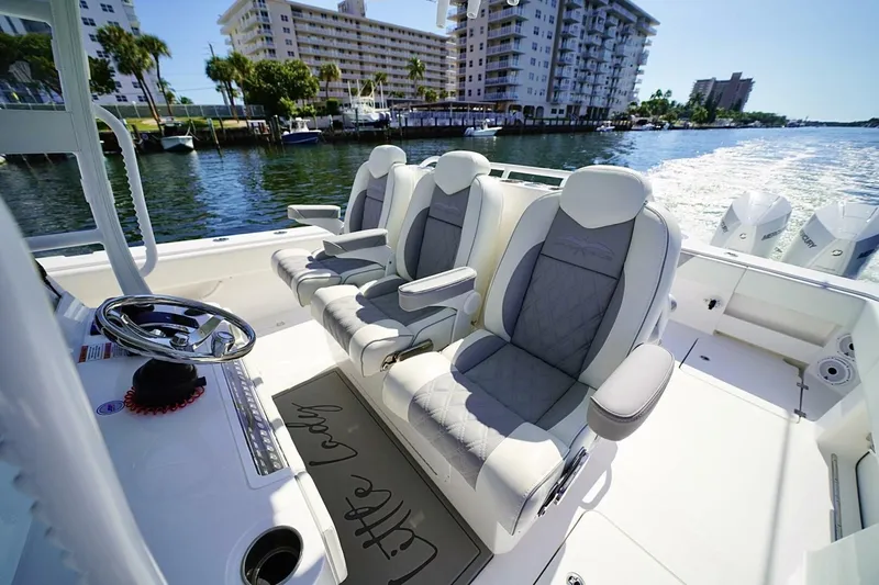 Little Lady Yacht Photos Pics 2024 Invincible 35 Catamaran interior with luxury seating and waterfront view.