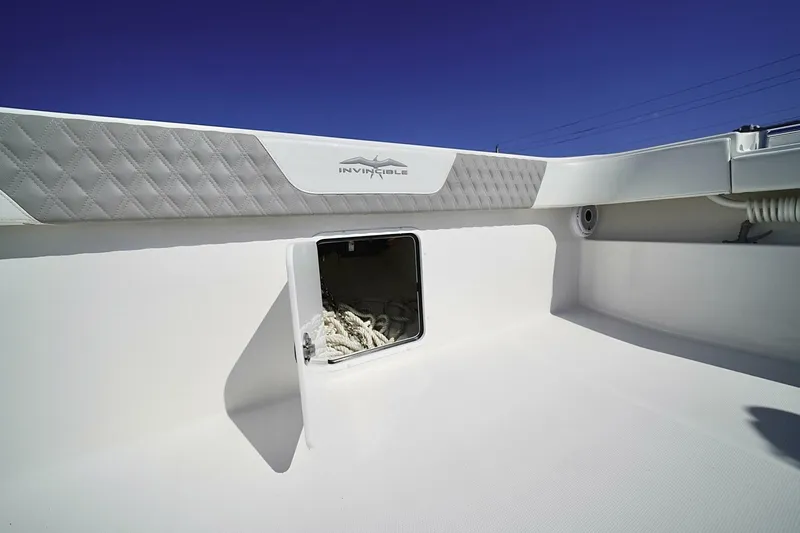 Little Lady Yacht Photos Pics 2024 Invincible 35 Catamaran interior with storage compartment and quilted detailing.