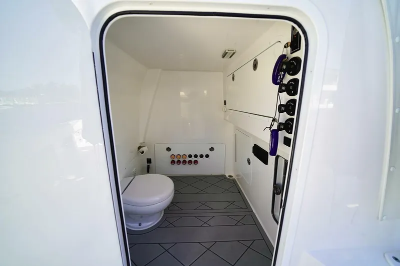 Little Lady Yacht Photos Pics 2024 Invincible 35 Catamaran interior bathroom with modern fixtures and controls.