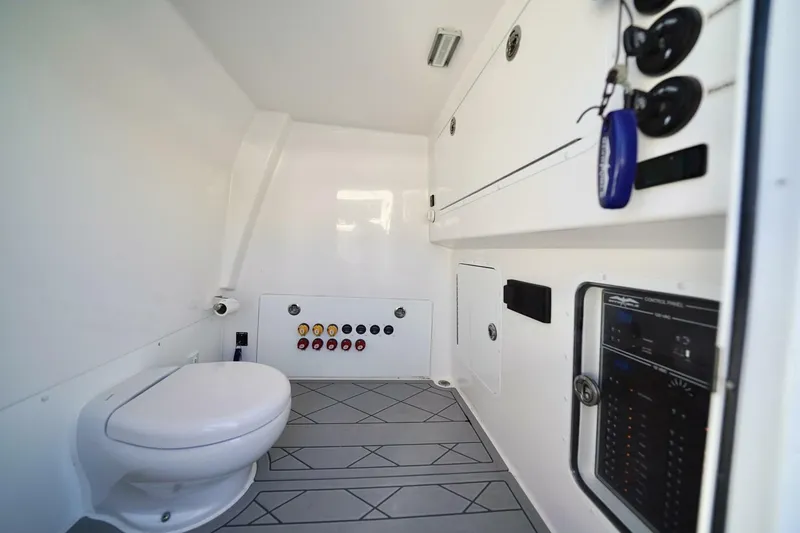Little Lady Yacht Photos Pics 2024 Invincible 35 Catamaran interior with modern bathroom and control panel features.