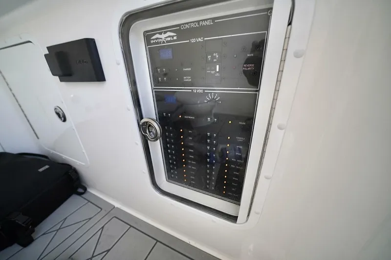 Little Lady Yacht Photos Pics Control panel of 2024 Invincible 35 Catamaran, featuring electrical switches and indicators.