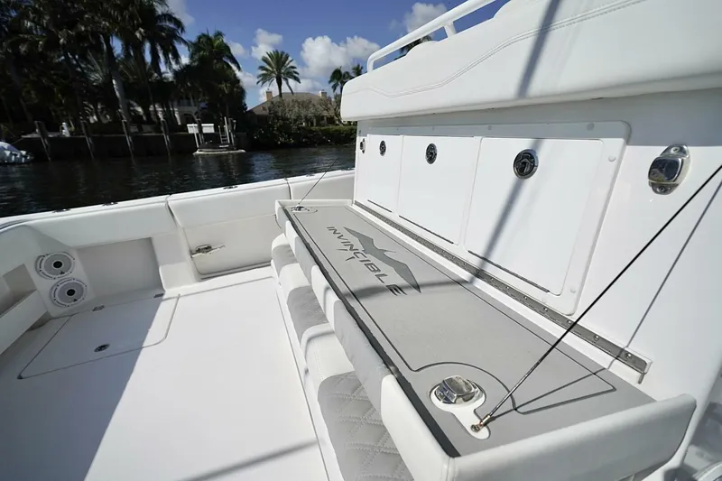 Little Lady Yacht Photos Pics 2024 Invincible 35 Catamaran interior with seating and storage, dockside view.