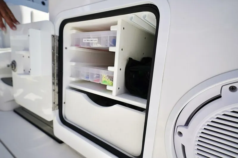 Little Lady Yacht Photos Pics Open storage compartment on 2024 Invincible 35 Catamaran, featuring organized tackle boxes.