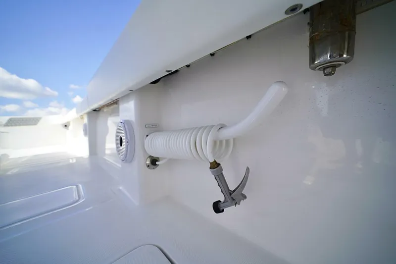 Little Lady Yacht Photos Pics 2024 Invincible 35 Catamaran deck with coiled hose and speaker.