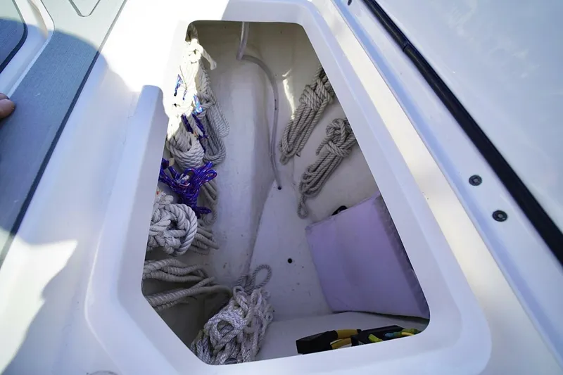 Little Lady Yacht Photos Pics Storage compartment of 2024 Invincible 35 Catamaran with ropes and accessories.