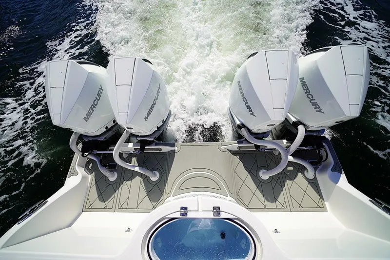 Little Lady Yacht Photos Pics 2024 Invincible 35 Catamaran with four Mercury outboard engines on water.