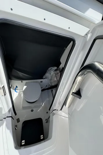 252 - 457 Yacht Photos Pics 2025 Blackfin 252 CC boat interior with compact marine toilet.