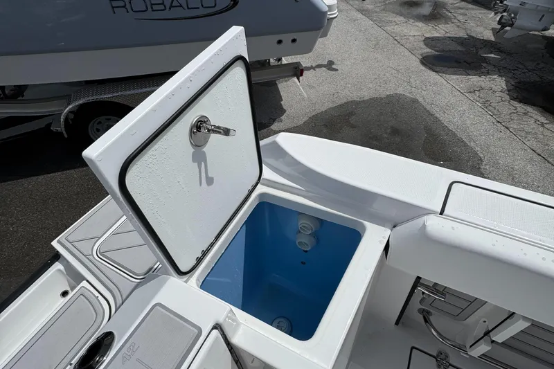 252 - 457 Yacht Photos Pics Open storage compartment on 2025 Blackfin 252 CC boat, showcasing interior design.