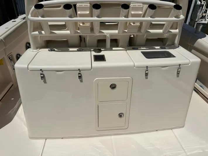 Sea-keeper/gen/ac/trolling Motor Yacht Photos Pics 2021 Grady-White Canyon 336 boat with rod holders and storage compartments.