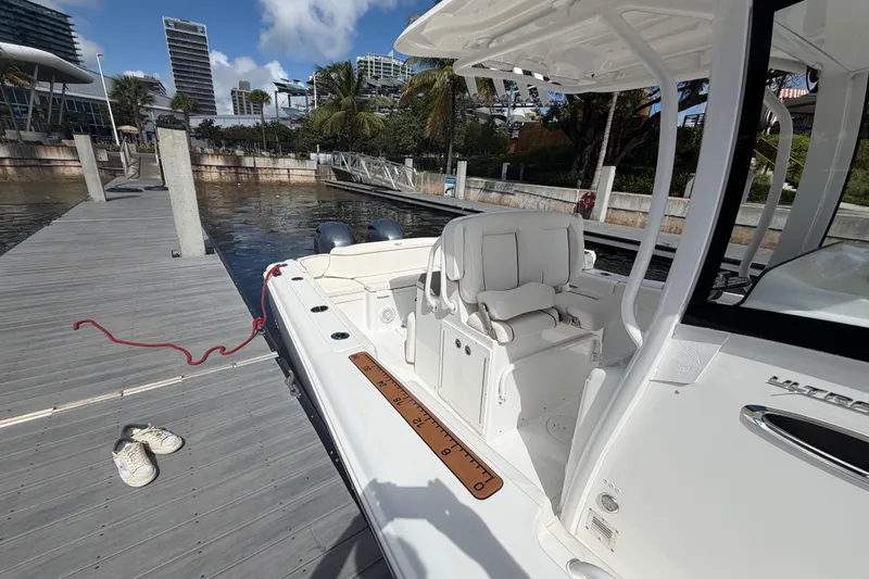  Yacht Photos Pics 2022 Sea Hunt Ultra 275 SE docked, featuring sleek design and comfortable seating.