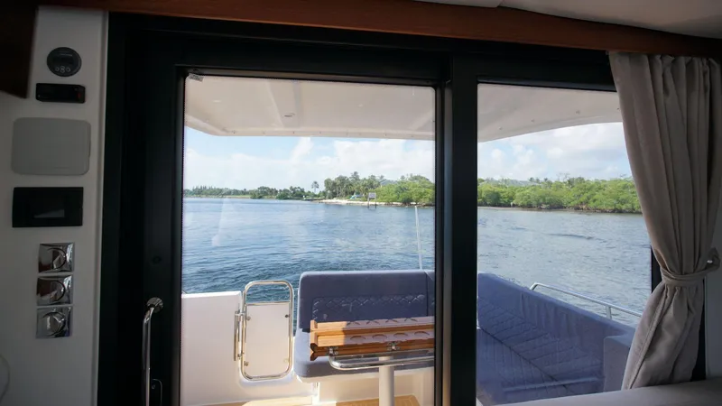 In-stock 2024 Nimbus 305 Coupé #393 Yacht Photos Pics View from Nimbus 305 Coupe #393, 2024 model, showing serene waters and lush greenery.