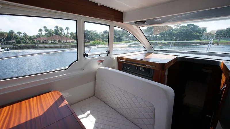 In-stock 2024 Nimbus 305 Coupé #393 Yacht Photos Pics Interior of 2024 Nimbus 305 Coupe #393 with waterfront view.