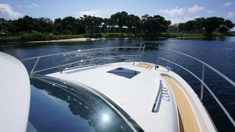 In-stock 2024 Nimbus 305 Coupé #393 Yacht Photos Pics Front deck of 2024 Nimbus 305 Coupe #393 cruising on a serene lake.