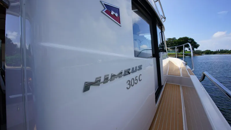 In-stock 2024 Nimbus 305 Coupé #393 Yacht Photos Pics 2024 Nimbus 305 Coupe #393 yacht side view on water.