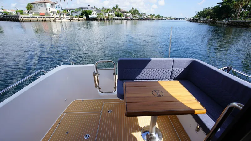 In-stock 2024 Nimbus 305 Coupé #393 Yacht Photos Pics Aft deck of 2024 Nimbus 305 Coupe #393 with waterfront view.