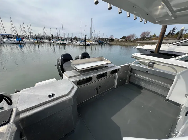  Yacht Photos Pics 2021 Velocity LC3311 boat interior with storage, docked at marina.