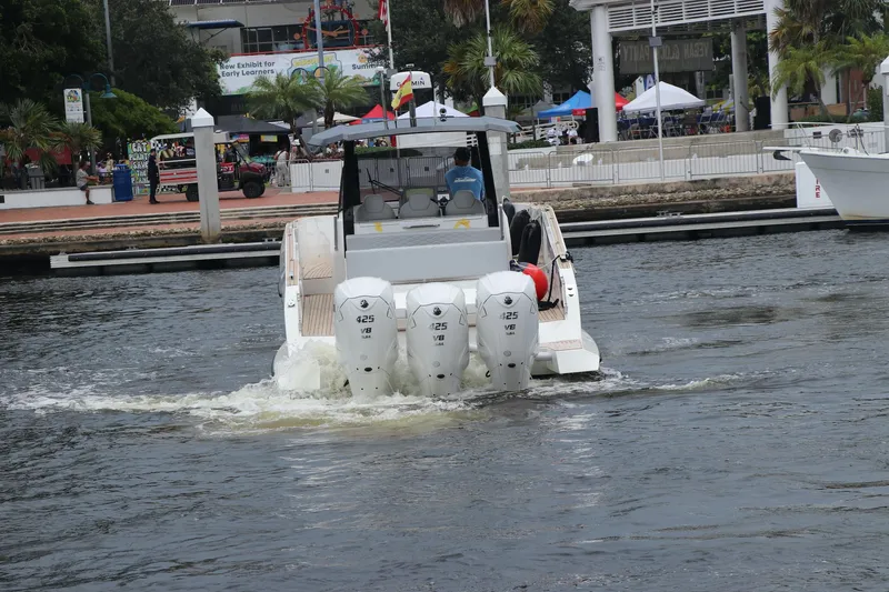  Yacht Photos Pics 2024 Astondoa 377 Coupe Outboard cruising in a marina.