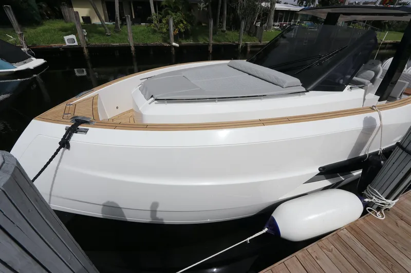  Yacht Photos Pics 2024 Astondoa 377 Coupe Outboard docked, showcasing sleek design and modern features.
