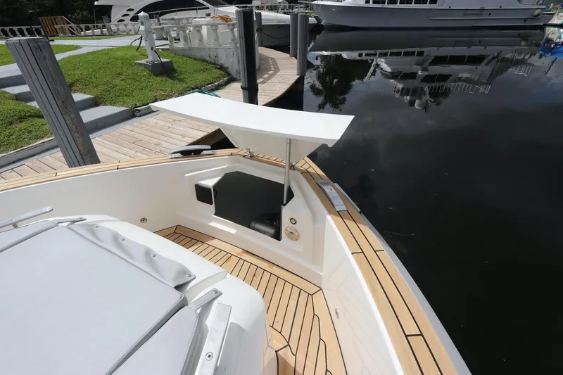  Yacht Photos Pics 2024 Astondoa 377 Coupe Outboard, sleek deck design by the water.