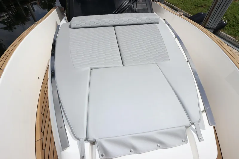  Yacht Photos Pics 2024 Astondoa 377 Coupe Outboard boat with sleek deck design and cushioned seating.