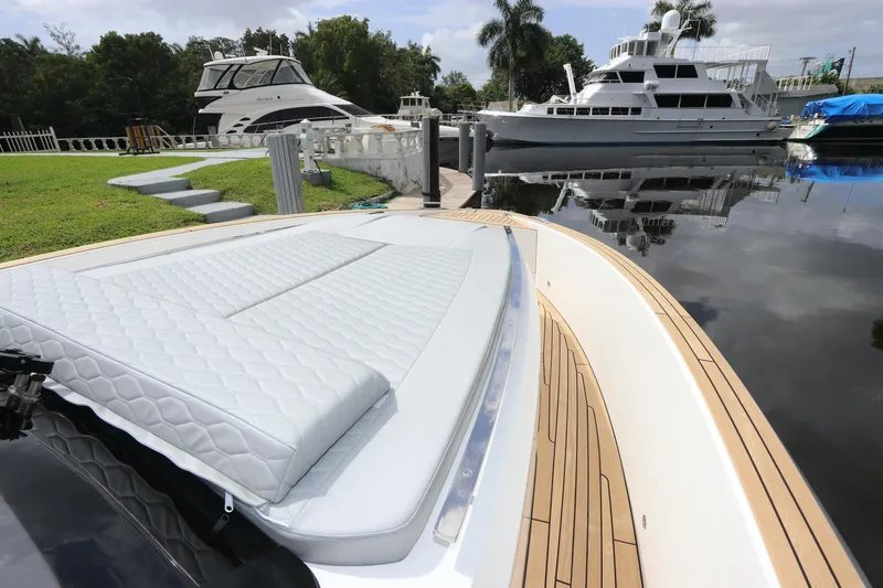  Yacht Photos Pics 2024 Astondoa 377 Coupe Outboard docked, featuring sleek design and luxurious deck.
