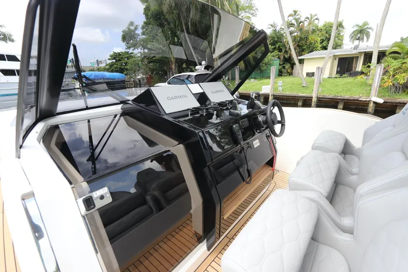  Yacht Photos Pics 2024 Astondoa 377 Coupe Outboard helm with modern controls and luxurious seating.