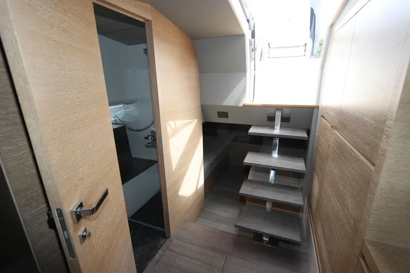  Yacht Photos Pics Interior of 2024 Astondoa 377 Coupe Outboard, featuring modern wooden stairs and sleek design.