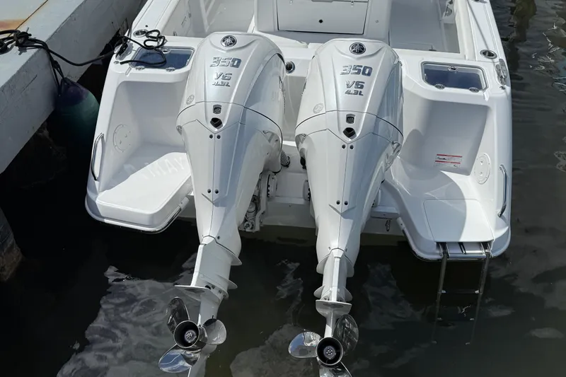  Yacht Photos Pics 2026 Everglades 315 Center Console with twin 350 V6 outboard engines at dock.