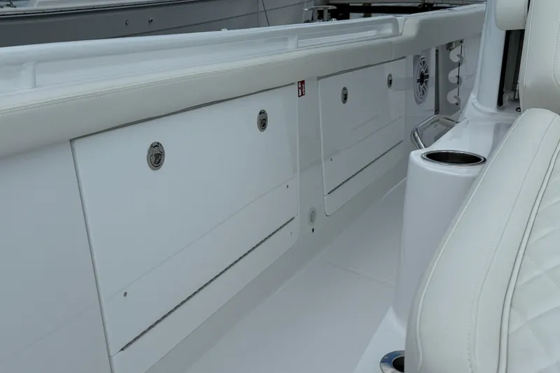  Yacht Photos Pics 2026 Everglades 315 Center Console interior with storage compartments and seating.