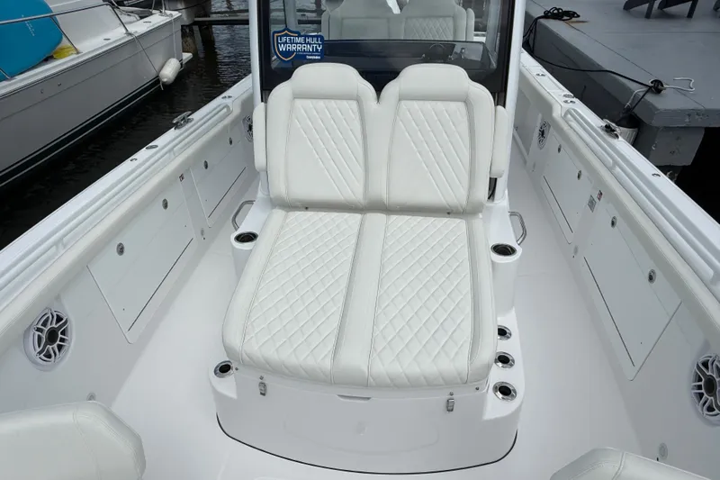 Yacht Photos Pics 2026 Everglades 315 Center Console boat with luxurious white seating and cup holders.