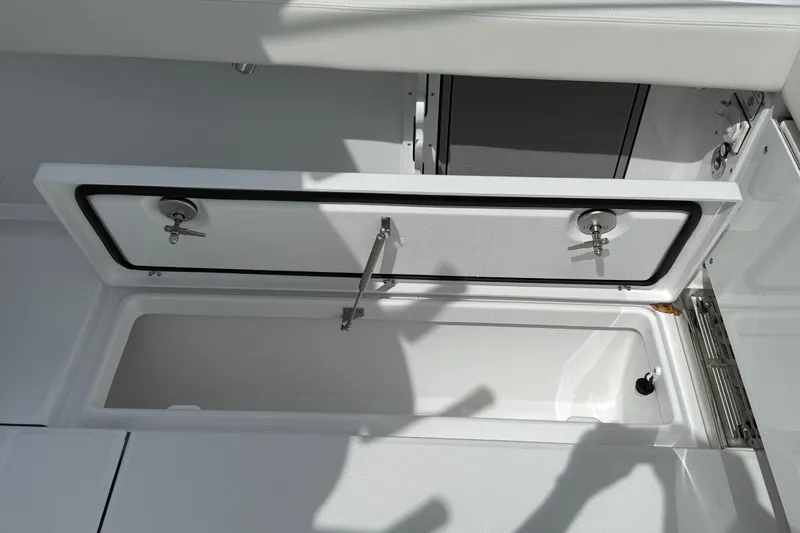  Yacht Photos Pics Open storage compartment on 2026 Everglades 315 Center Console boat.