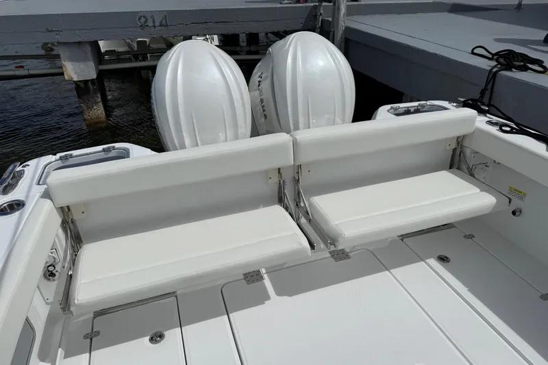  Yacht Photos Pics 2026 Everglades 315 Center Console boat with dual outboard engines and white seating.