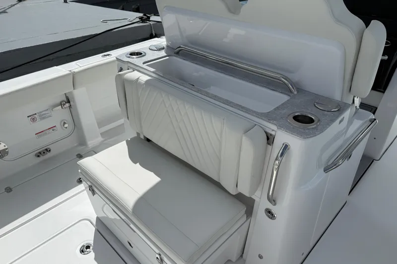  Yacht Photos Pics 2026 Everglades 315 Center Console boat interior with cushioned seating and storage.