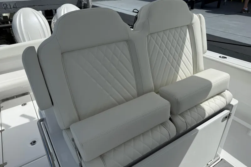  Yacht Photos Pics Luxurious seating on 2026 Everglades 315 Center Console boat with quilted white upholstery.