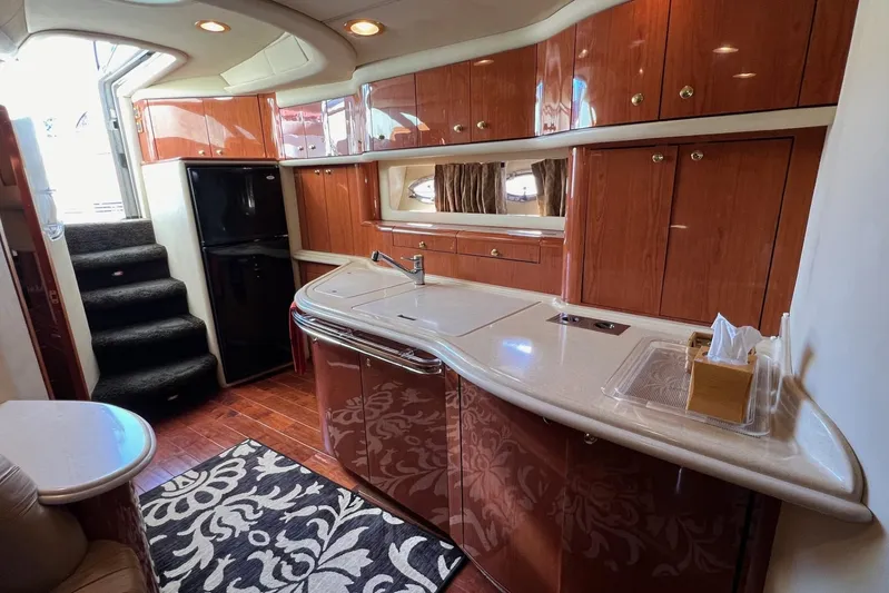  Yacht Photos Pics Luxurious 1998 Sea Ray 540 Sundancer yacht interior with elegant wood cabinetry and modern amenities.