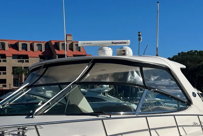  Yacht Photos Pics 1998 Sea Ray 540 Sundancer yacht with Raymarine radar, docked under clear blue sky.