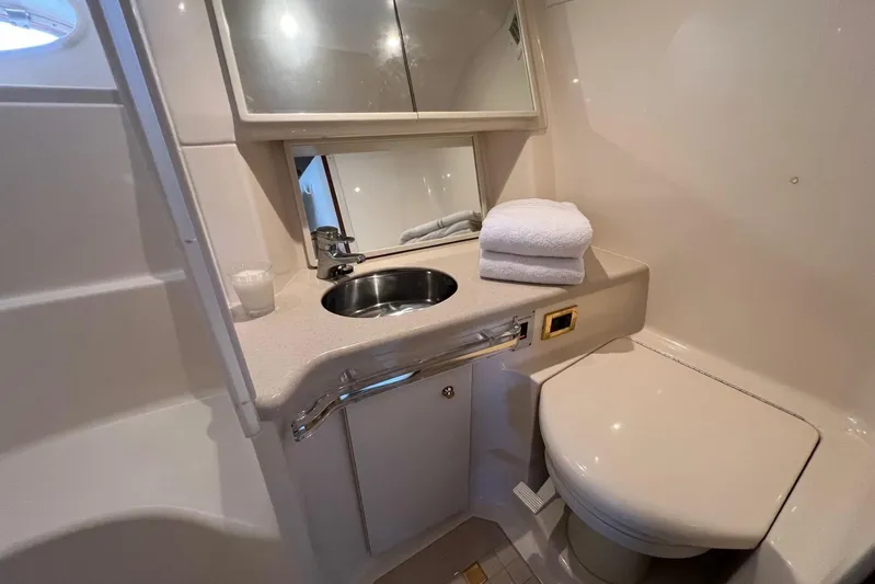  Yacht Photos Pics Luxurious bathroom in 1998 Sea Ray 540 Sundancer yacht with sink and toilet.