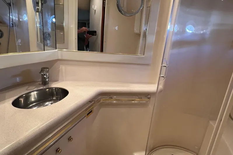  Yacht Photos Pics Bathroom interior of 1998 Sea Ray 540 Sundancer yacht with sink and mirror.
