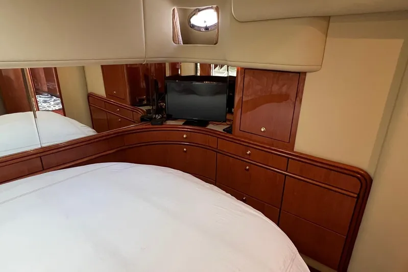  Yacht Photos Pics Luxurious cabin interior of 1998 Sea Ray 540 Sundancer yacht with TV and wooden cabinetry.