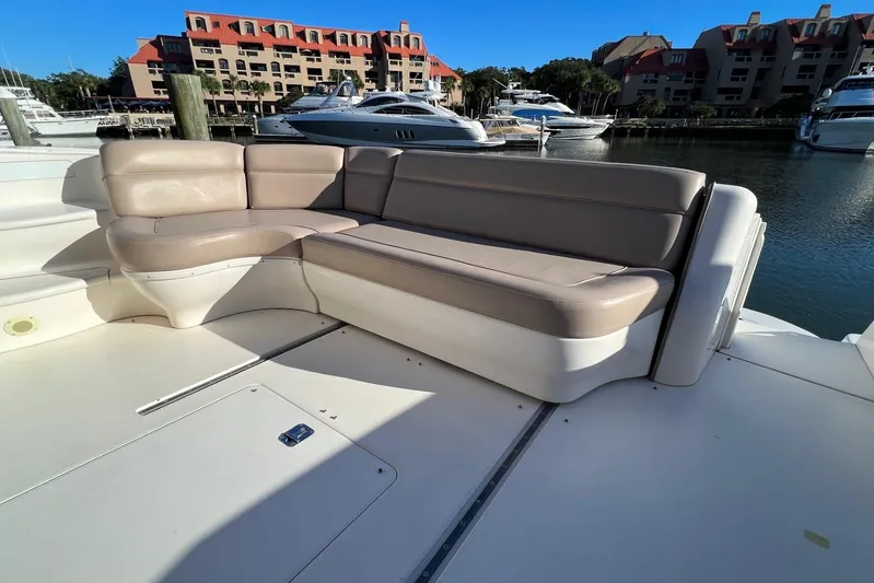 Yacht Photos Pics Luxury seating on 1998 Sea Ray 540 Sundancer yacht, docked in a marina.