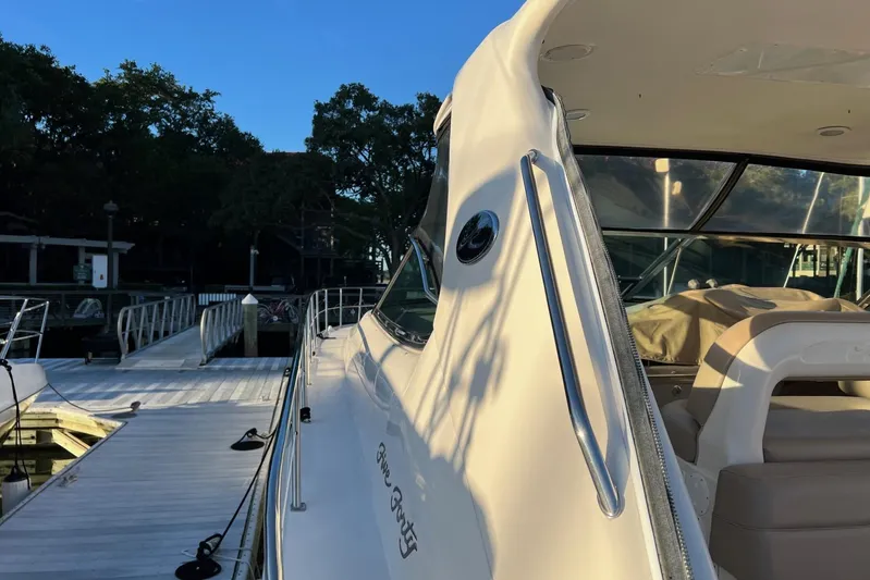  Yacht Photos Pics 1998 Sea Ray 540 Sundancer yacht docked at marina, side view in sunlight.