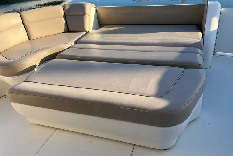  Yacht Photos Pics Luxurious seating on a 1998 Sea Ray 540 Sundancer yacht, featuring beige cushions.