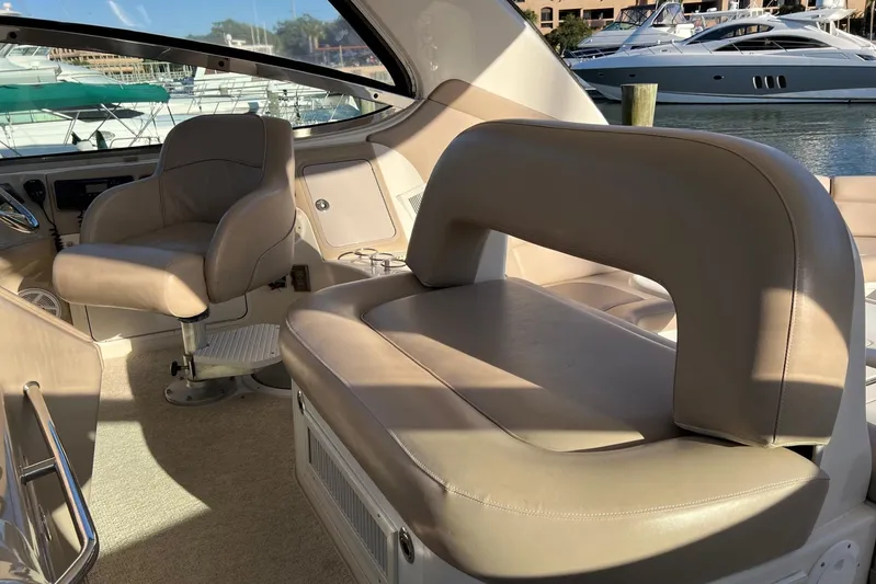  Yacht Photos Pics Interior of 1998 Sea Ray 540 Sundancer yacht with beige leather seating and helm chair.