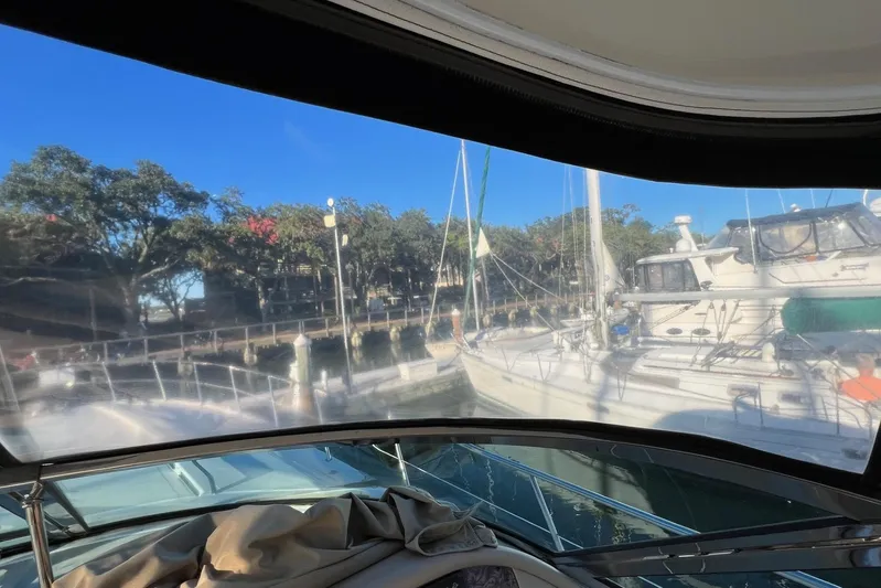  Yacht Photos Pics View from 1998 Sea Ray 540 Sundancer, overlooking marina with sailboats and trees.