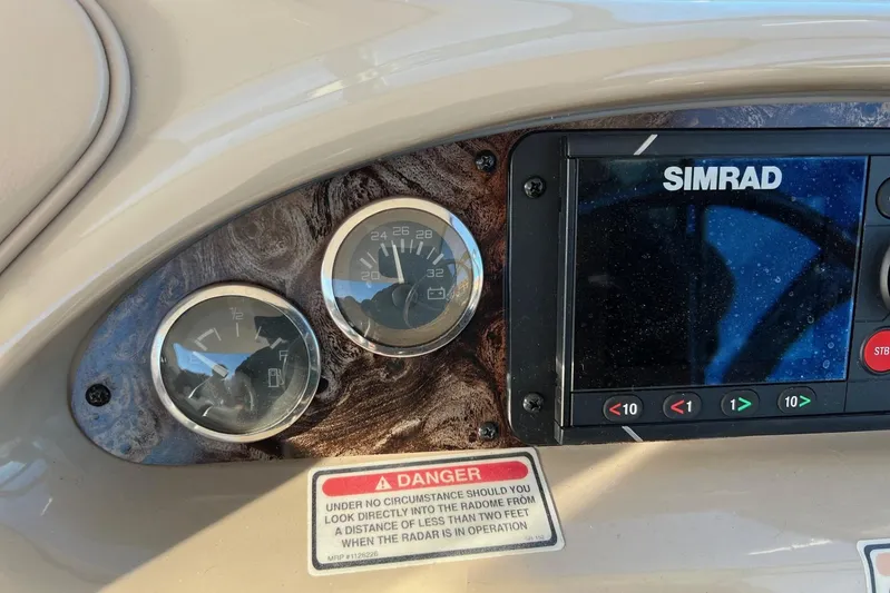  Yacht Photos Pics Dashboard of a 1998 Sea Ray 540 Sundancer with gauges and Simrad display.