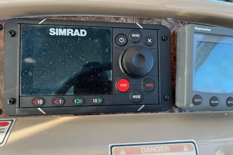 Yacht Photos Pics Control panel of a 1998 Sea Ray 540 Sundancer with Simrad and Raymarine displays.