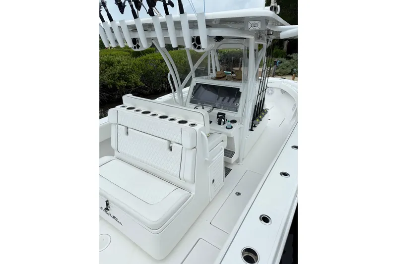  Yacht Photos Pics 2022 SeaHunter 33 Tournament boat interior with seating and fishing rod holders.